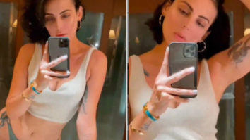Mandana Karimi shares a video flaunting her curves in a bikini bottom and white crop-top