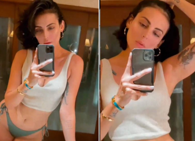 Mandana Karimi shares a video flaunting her curves in a bikini bottom and white crop-top