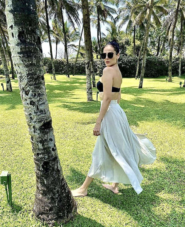 Mandana Karimi raises the summer heat in strapless bra and high-waist ...