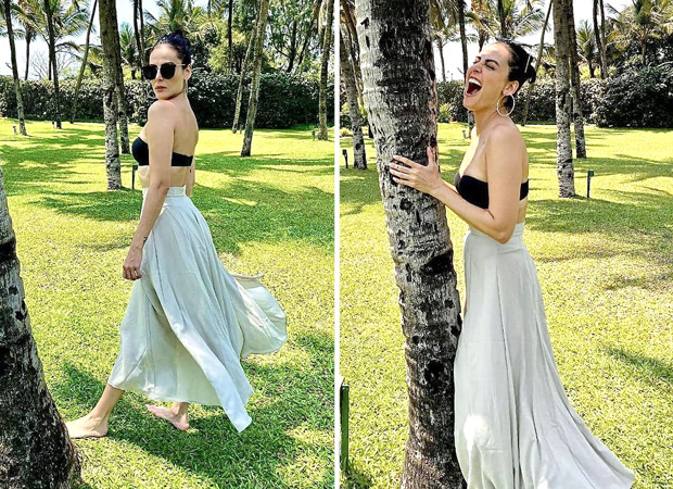 Mandana Karimi raises the summer heat in strapless bra and high-waist skirt
