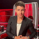 Nick Jonas returns to The Voice after hospitalisation, reveals he 'cracked rib from a spill on a bike'