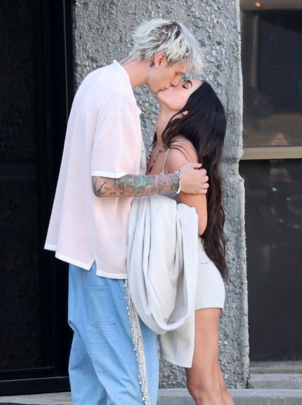Megan Fox and Machine Gunn Kelly share a kiss; actress dons beige bustier and shorts for a motorcycle ride