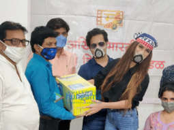 Photos: Poonam Pandey snapped distributing rations and essentials to spot boys