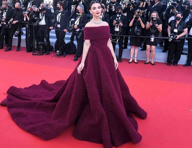 Amy Jackson makes opulent red carpet appearance at Cannes 2021 in long-trail burgundy off-shoulder gown
