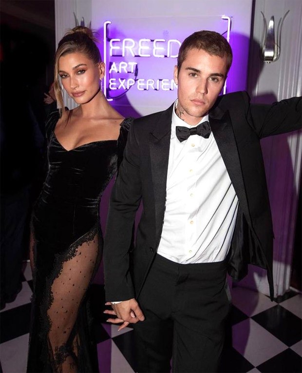 Justin Bieber looks dapper in black YSL tuxedo worth Rs. 2.14 lakh; wife Hailey Bieber stuns in lace Alessandra Rich thigh-high slit velvet dress