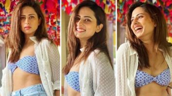 Sargun Mehta’s off-duty look consists of a printed bralette, high waisted denim shorts & white shirt