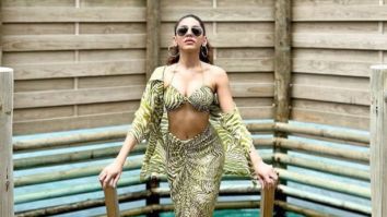 Alaya F turns up the heat in a sexy striped bikini top, matching wrap skirt and overlay in Maldives