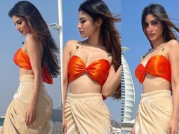 Mouni Roy pairs a neon orange bikini top with thigh-high slit skirt in Dubai