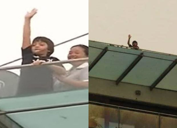 Shah Rukh Khan’s son AbRam Khan waves to the media from his house after brother Aryan Khan gets bail