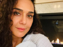 New mom Preity Zinta cuddles one of her twins in first picture of her newborn