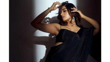 Pushpa: The Rise actress Rashmika Mandanna looks sultry in black black chiffon saree, cropped bralette
