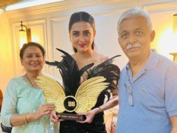Bigg Boss 15 winner Tejasswi Prakash poses with her parents after lifting Bigg Boss 15 trophy