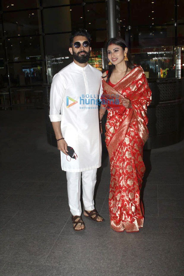 Newlywed Mouni Roy glows in red Banarasi saree with husband Suraj Nambiar as they make first appearance at airport in Mumbai