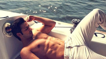 Varun Dhawan poses shirtless on a boat in the middle of the sea; Katrina Kaif reacts