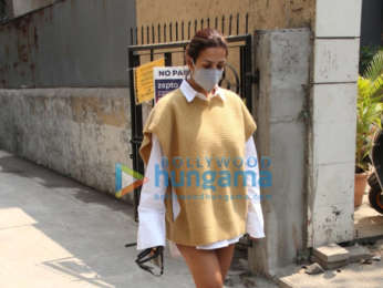 Photos: Malaika Arora pairs full sleeve shirt and beige sweater and mini shorts as she gets snapped outside a clinic in Santacruz
