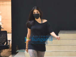 Photos: Rhea Chakraborty waves at the paparazzi as she walks out of a gym in Khar
