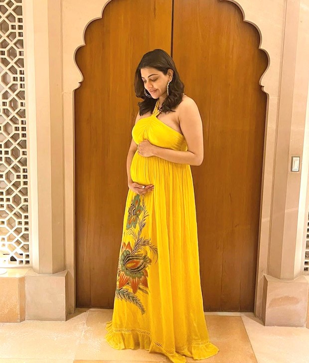 Kajal Aggarwal slays maternity fashion in halter-neck yellow chiffon patterned maxi dress worth Rs.10,000