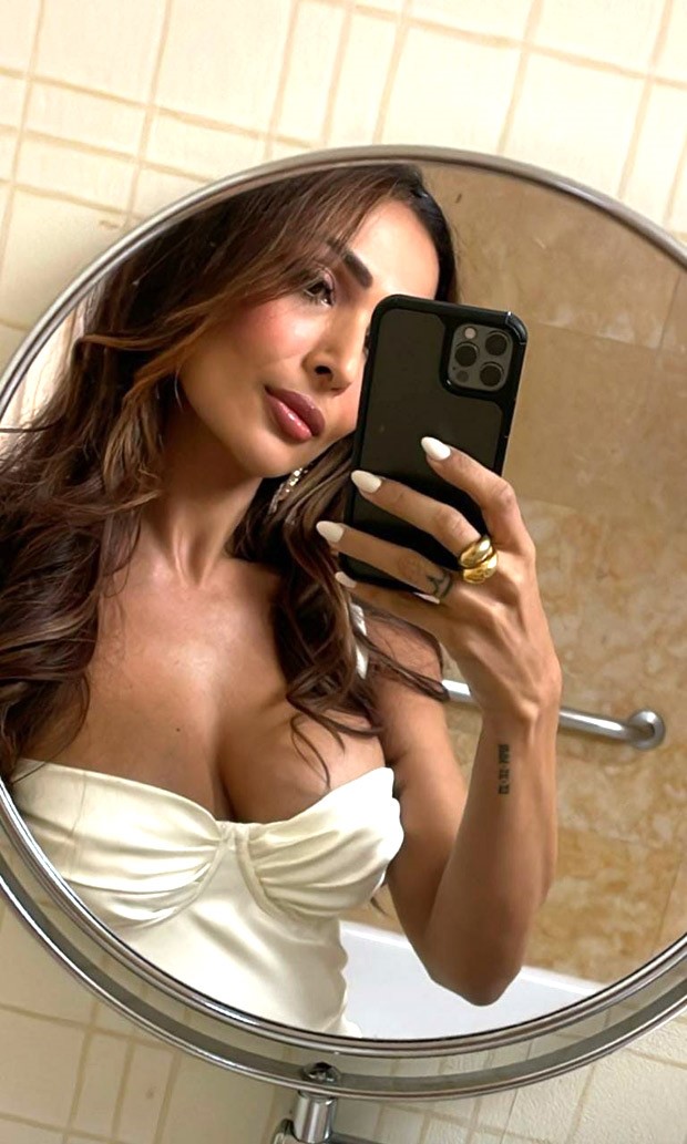 Malaika Arora is vision in pearl white strappy corset style thigh-high slit dress Malaika Arora is vision in pearl white strappy corset style thigh-high slit dress