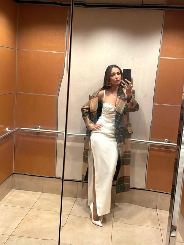 Malaika Arora is vision in pearl white strappy corset style thigh-high slit dress Malaika Arora is vision in pearl white strappy corset style thigh-high slit dress