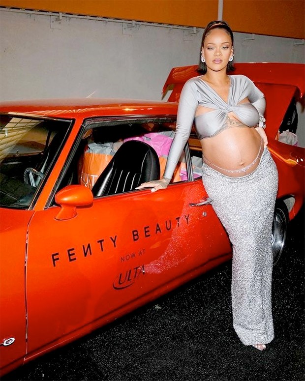 Rihanna makes statement for pregnancy fashion; goes from criss-cross halter neck top and shimmery skirt to semi-sheer black ensemble flaunting her baby bump