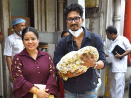 Bharti Singh and Harsh Limbachiyaa pose with their baby boy outside hospital