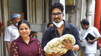 Bharti Singh and Harsh Limbachiyaa pose with their baby boy outside hospital