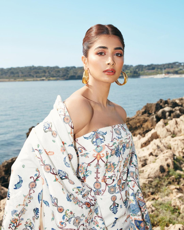 Cannes 2022: Pooja Hegde is epitome of grace and panache in floral printed jacquard strapless dress and long cape worth over Rs. 2 lakh  Cannes 2022: Pooja Hegde is epitome of grace and panache in floral printed jacquard strapless dress and long cape worth over Rs. 2 lakh