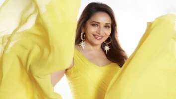Madhuri Dixit stuns in an opulent yellow flared gown for her latest single ‘Tu Hai Mera’