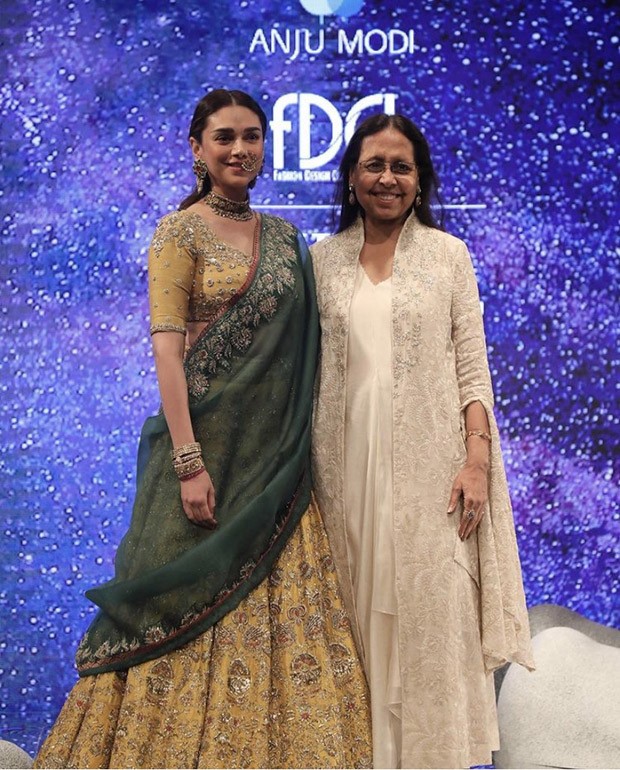 Aditi Rao Hydari is an elegant showstopper as she walks at couture week in dull gold lehenga by Anju Modi
