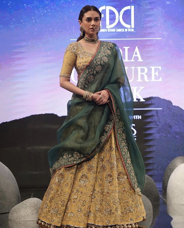 Aditi Rao Hydari is an elegant showstopper as she walks at couture week in dull gold lehenga by Anju Modi