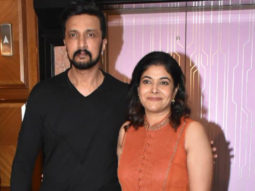 Kichcha Sudeepa poses with his wife for paps