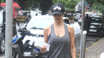 Malaika Arora smiles as she poses for paps