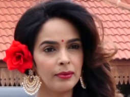 Mallika Sherawat spotted at Bandra Station rocking a red rose in her hair