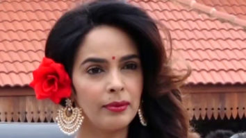 Mallika Sherawat spotted at Bandra Station rocking a red rose in her hair