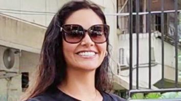 Esha Gupta greets paps with a smile