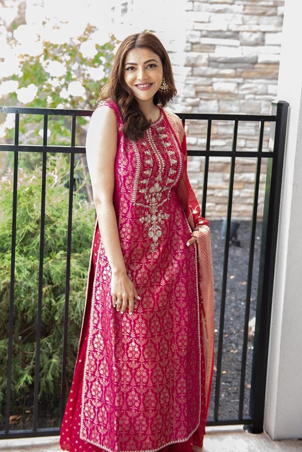 Kajal Aggarwal looks resplendent in a red Benarasi sharara set worth Rs. 1,20,000