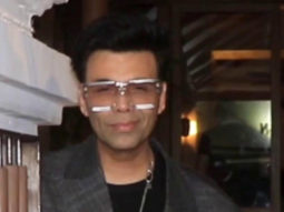 Karan Johar snapped in an oversized coat and funky glasses