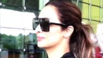 Malaika Arora looks airport ready in black top and denims