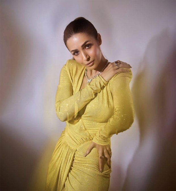 Malaika Arora looks resplendent in bold yellow dress featuring a thigh-high slit at the Filmfare awards