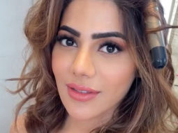 Nikki Tamboli looks graceful in orange outfit
