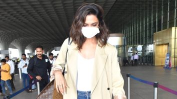 Deepika Padukone teams her beige coat and baggy pants with a Louis