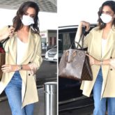 Deepika Padukone pairs LV x YK Dauphine MM bag worth Rs. 3.55 lacs with  blazer, baggy jeans for airport look