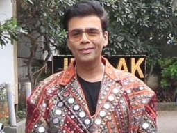 Karan Johar poses in funky mirrored jacket