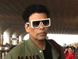 Karan Johar walks in swag at the airport