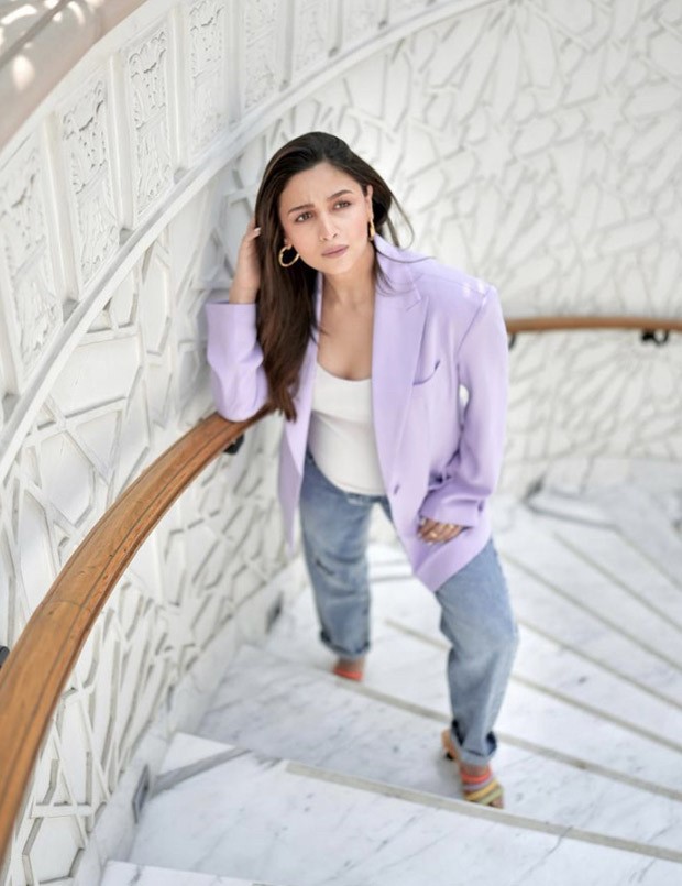 Mom-to-be Alia Bhatt looks cute in an ensemble of a purple blazer, jeans, and vibrant heels