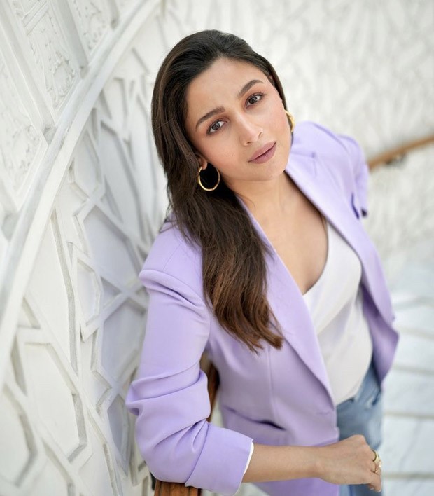 Mom-to-be Alia Bhatt looks cute in an ensemble of a purple blazer, jeans, and vibrant heels