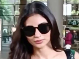 Mouni Roy poses for paps at the airport in green crop top
