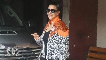 Neha Dhupia clicked in a funky orange jacket