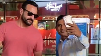 Saif Ali Khan poses with fans at the airport