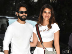 Varun Dhawan and Kriti Sanon twin in white as they pose together